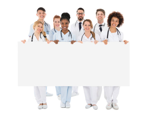 istock Group Of Medical Team Holding Blank Billboard 909303670