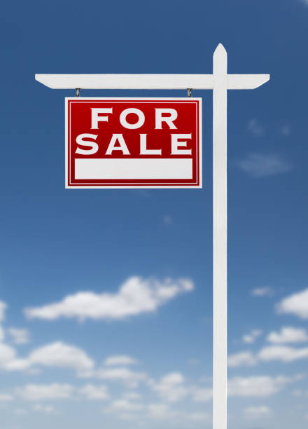 istock Left Facing For Sale Real Estate Sign on a Blue Sky with Clouds. 909309798