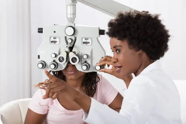 Photo of Optometrist Doing Sight Testing For Patient