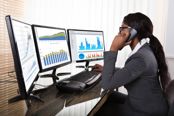 istock Businesswoman Looking At Graphs On Computer 909310492