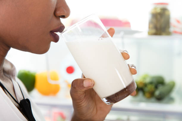 istock Woman Drinking Glass Of Milk 909314018