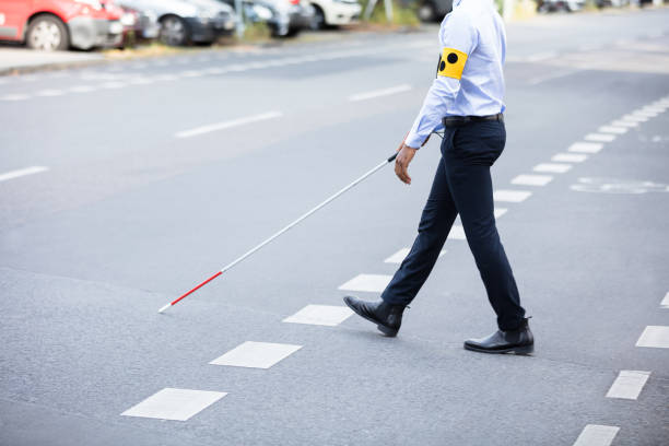 istock Blind Person Walking On Street 909314674