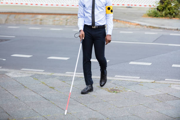 istock Blind Person Walking On Street 909314684