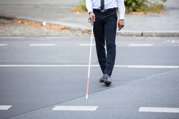 istock Blind Person Walking On Street 909314688