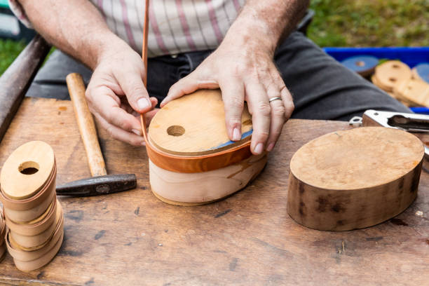 istock Working Hands -- An Artist Making Wooden Boxes the Old Fashioned Way 909328422