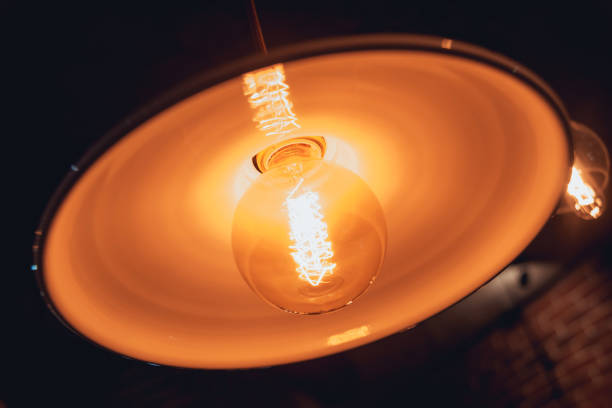 istock Loft pendant lamps with edison light bulbs. 909329338