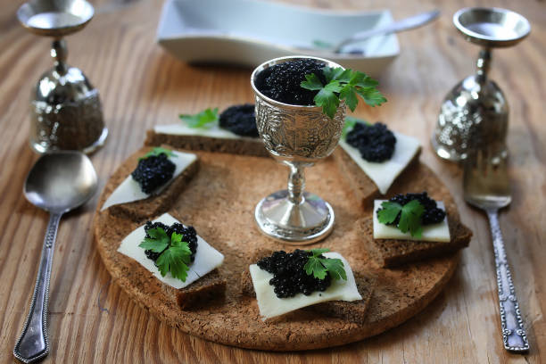 istock snack black caviar on a wooden background 909332302
