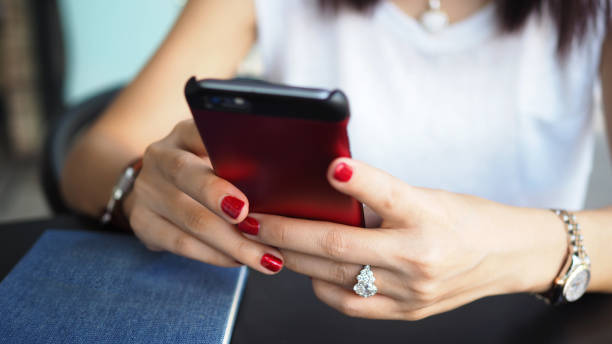 istock Closeup of woman hands using a smartphone. 909332634