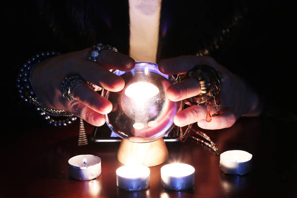 istock Future teller guessing on a glass ball 909335382
