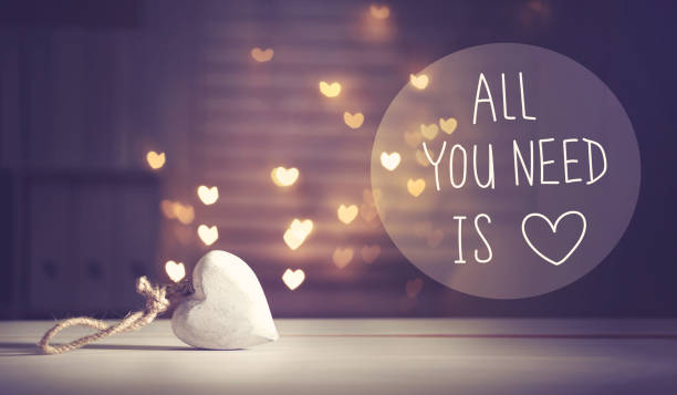 istock All You Need Is Love message with a white heart 909336338