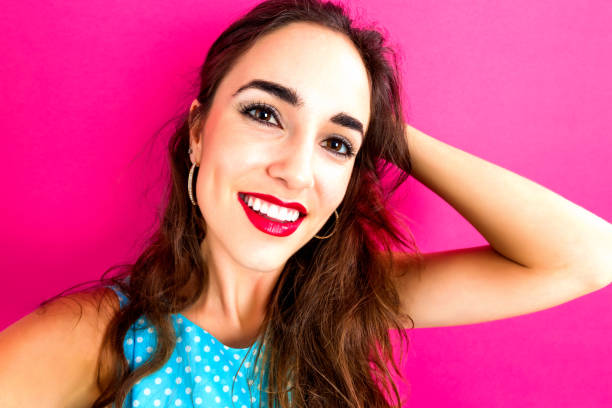 istock Young woman taking a selfie 909336372
