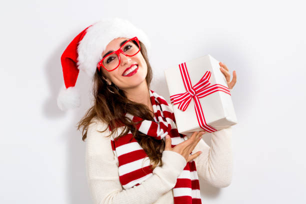 istock Young woman holding a Christmas gift 909336424