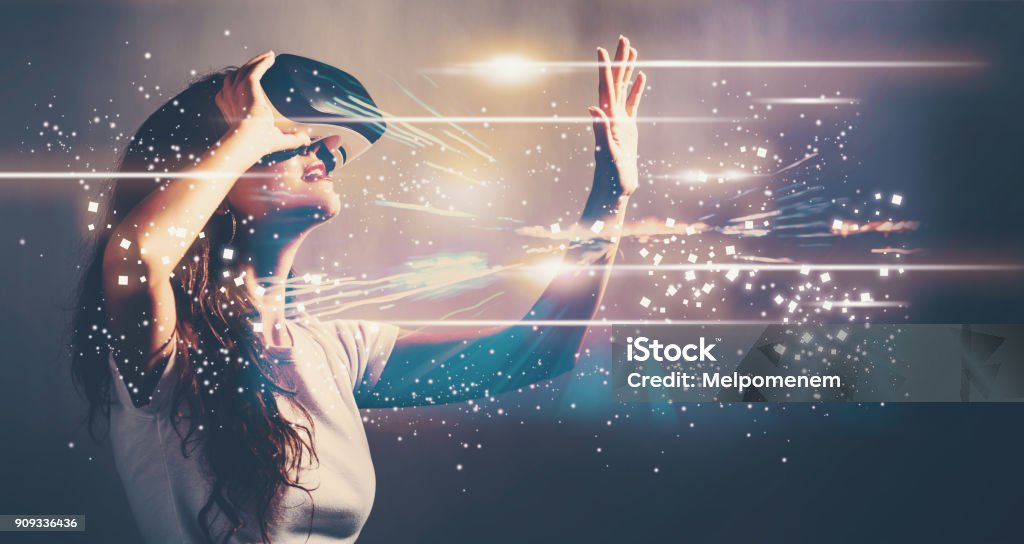 Digital Screen with young woman with VR Digital Screen with young woman using a virtual reality headset Virtual Reality Simulator Stock Photo