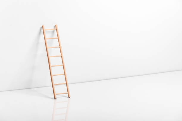 istock Wooden ladder leaning against the wall 909337016