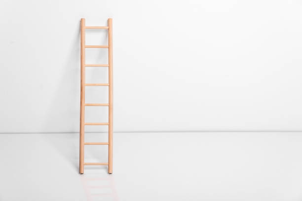 istock Wooden ladder leaning against the wall 909337080