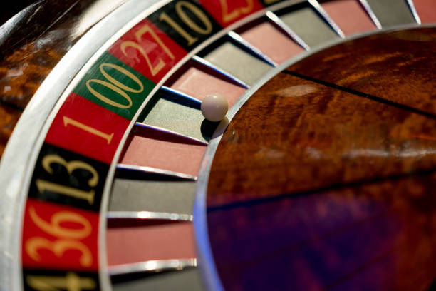 A roulette wheel spinning, numbers just visible in motion