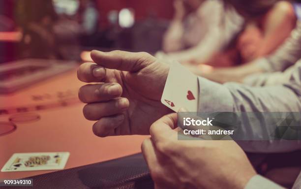 Man Hiding An Ace Under In His Sleeve At The Casino Stock Photo - Download Image Now