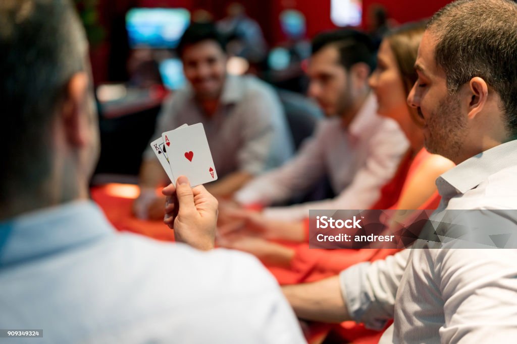 Group of people playing blackjack at the casino Group of people playing blackjack at the casino - lifestyle concepts Playing Stock Photo
