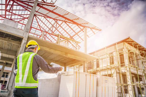 istock Asian business man construction engineer worker at house building site 909349818