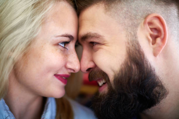 istock Happy couple looking into eyes 909353990
