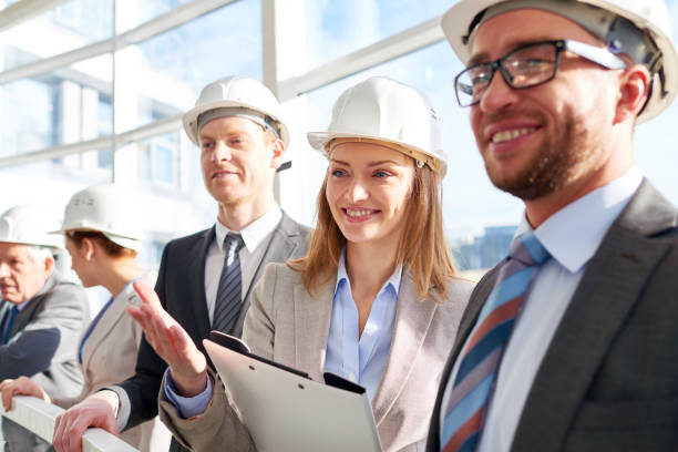 istock Real estate agent demonstrating new building 909360062