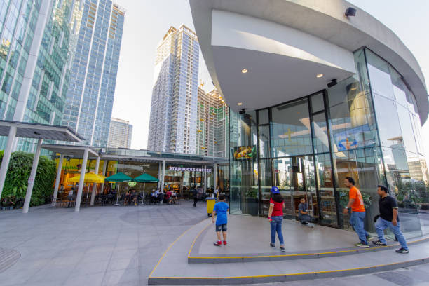 Jan 20,2018 People entering the chapel in Up town mall , Taguig city Jan 20,2018 People entering the chapel in Up town mall , Taguig city, Philippines taguig stock pictures, royalty-free photos & images