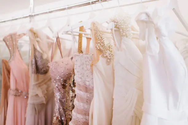 Photo of Luxury sparkling women's dresses on hangers
