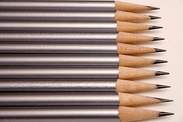 row of silver pencils stock photo