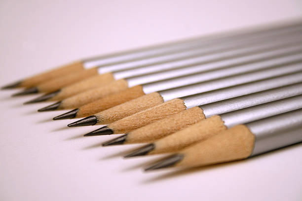 Row of silver pencils stock photo