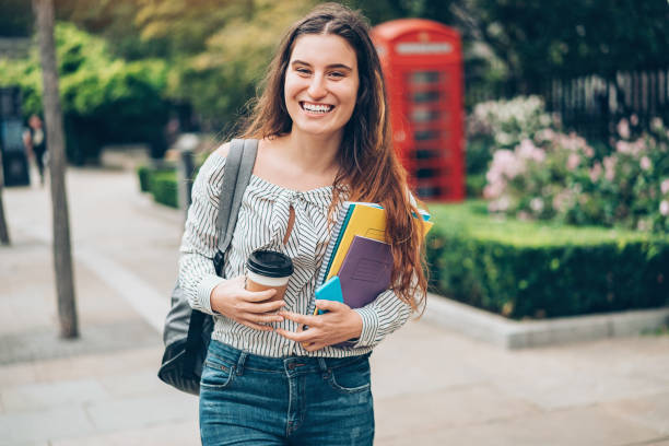 istock Cheerful student in London city 909367310