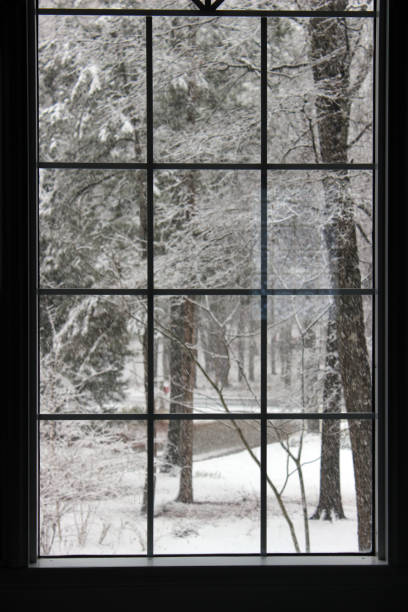 istock View of Snowy Scene Through a Window 909370584