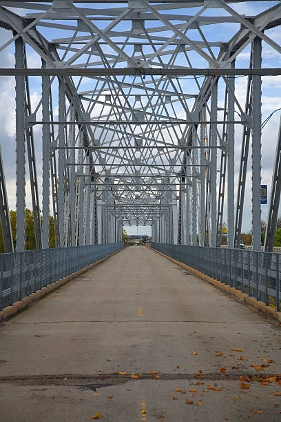 istock steel bridge against cloudy sky 90937603