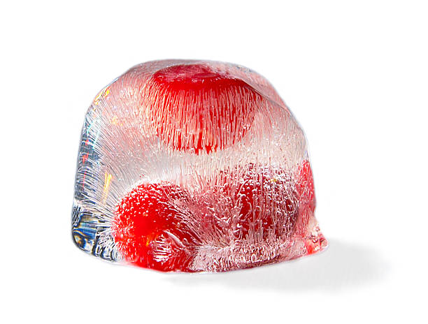 berry in cube of ice (isolated, clipping path) stock photo
