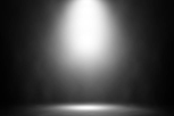 istock White spotlight smoke stage nightclub background. 909377888