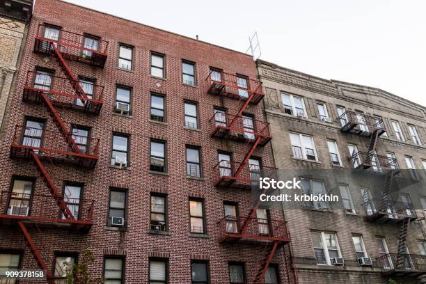 Brick Apartment Condo Building Exterior Architecture In Fordham Heights Center Bronx Nyc Manhattan New York City With Fire Escapes Windows Ac Units In Evening Stock Photo - Download Image Now