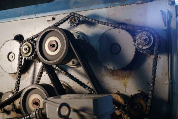 At sawmill. Image of rotating gears on running machine
