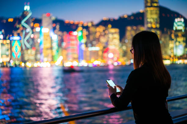 istock Young woman using a smartphone 909381360