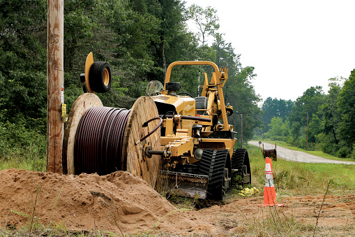 Power company installing underground electricity in Crivitz, WI, USA in August 2017. To eliminate over head wires.