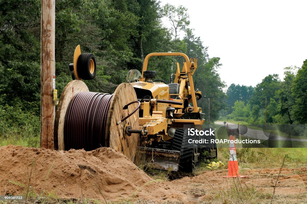 Fiber Optics Power company installing underground electricity in Crivitz, WI, USA in August 2017. To eliminate over head wires. Fiber Optic Stock Photo