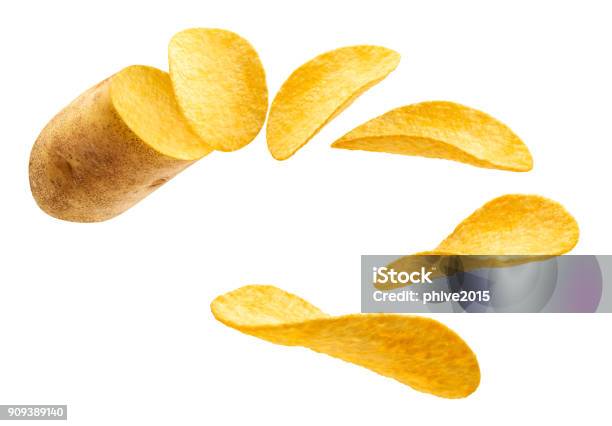 Flying Potato Slice Into Potato Chips Isolated Stock Photo - Download Image Now - Potato Chip, Raw Potato, Flying
