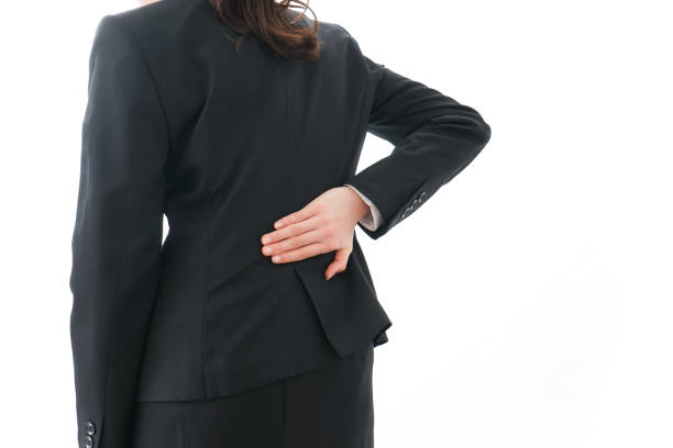 istock businesswoman suffering from backache 909394850