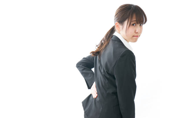 istock businesswoman suffering from backache 909394886