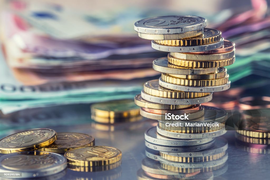 Money. Euro coins. Euro money. Euro currency.Coins stacked on each other in different positions. Money concept Money. Euro coins. Euro money. Euro currency.Coins stacked on each other in different positions. Money concept. Currency Stock Photo