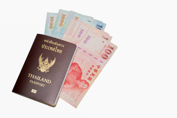 istock Thai passport with Taiwan Dollars isolated on white background. Copy space. 909395426