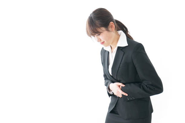 istock businesswoman suffering from stomachache 909395768