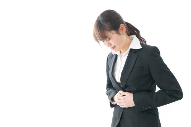 istock businesswoman suffering from stomachache 909395784