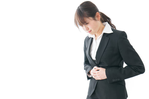 istock businesswoman suffering from stomachache 909395814
