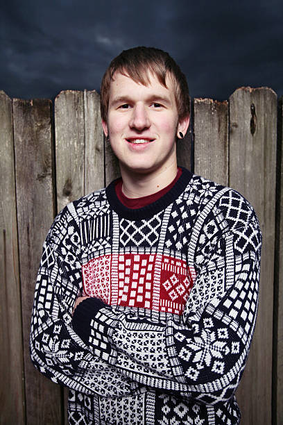 istock Ugly Sweater Man by a Fence 90939619