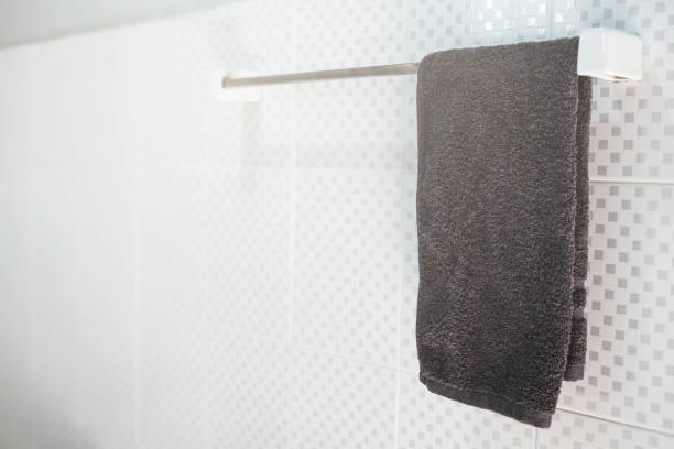 istock Bathroom interior and towel hanging on a railing 909398690