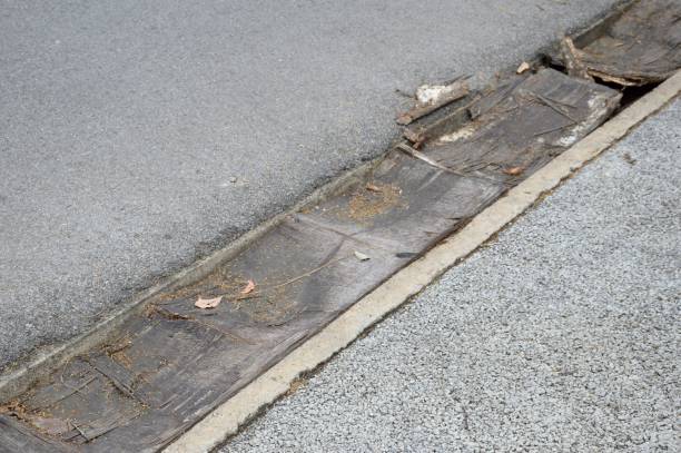 istock wood plank on drain in garden 909398998